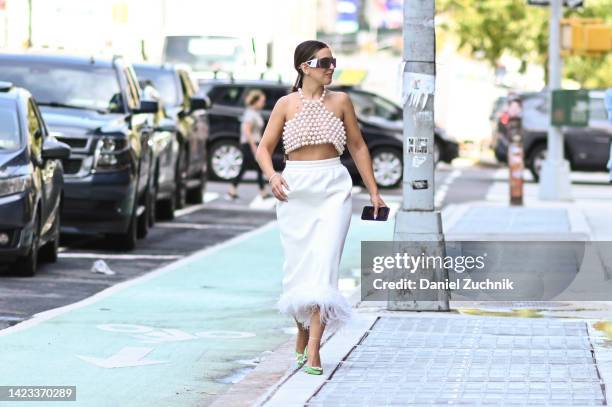 Cici Celia is seen wearing Pearlia Studio top and skirt, Amina Mauddi shoes, Dior sunglasses and Mam accessories outside the Veronica Beard show...