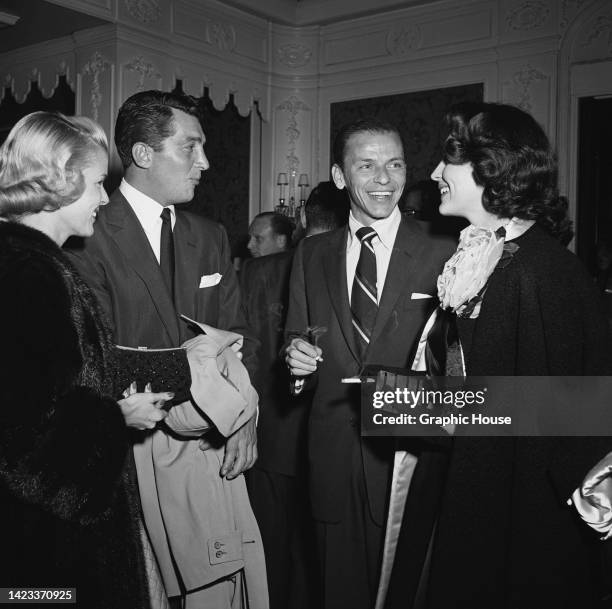 American beauty queen Jeanne Biegger and her husband, American actor, singer and comedian Dean Martin with American singer and actor Frank Sinatra...