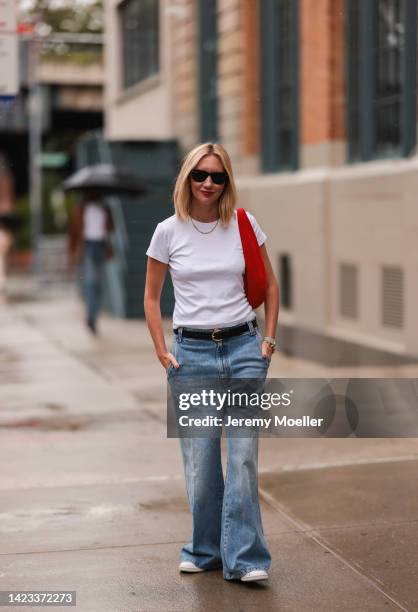 Lisa Aiken seen wearing a white shirt, a denim jeans and a black belt, a red handbag outside Khaite during New York Fashion Week on September 10,...