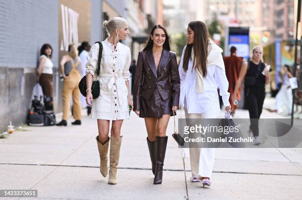 Caroline Daur, Olivia Perez and Tamara Kalinic are seen wearing Veronica Beard outfits outside the Veronica Beard show during New York Fashion Week...