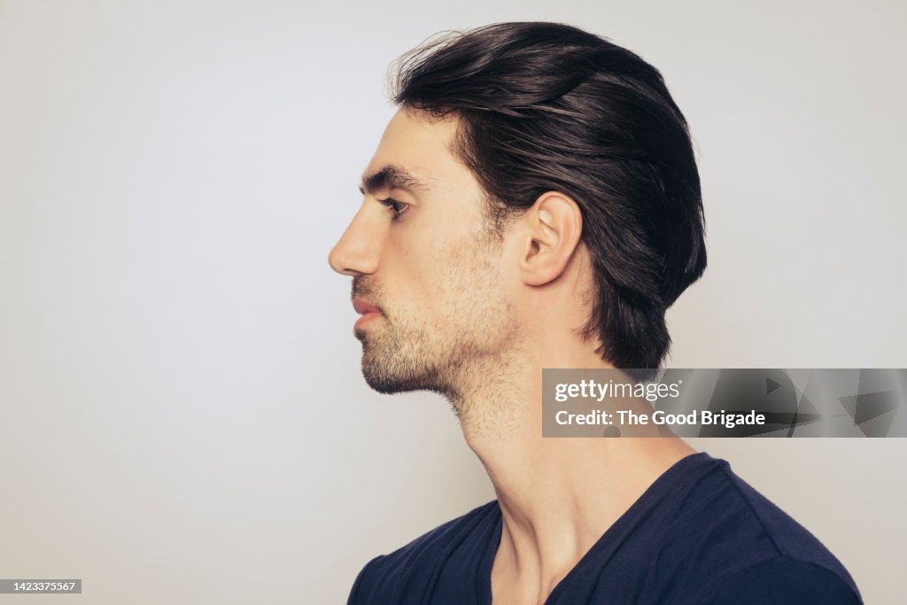 Profile view of young man in studio