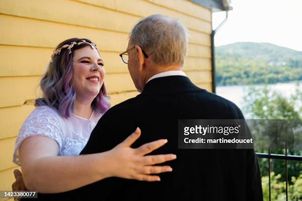 body positive future bride hugging grandfather before lgbtq+ wedding. - familys revenge of the bridesmaids stockfoto's en -beelden