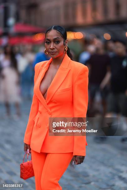 La La Anthony seen wearing an orange look, outside VOGUE WORLD during New York Fashion on September 12, 2022 in New York City.