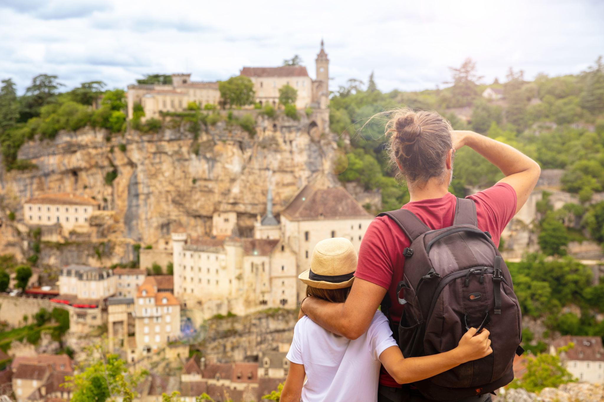 children and father looking panoramic view of Rocamadour- France children and father looking panoramic view of Rocamadour- France