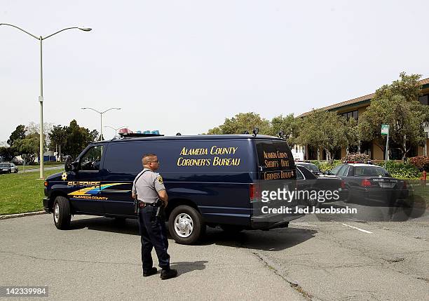 Sheriff coroner's van arrives to pick up the bodies of the shooting victims at Oikos University as police survey the scene on April 2, 2012 in...