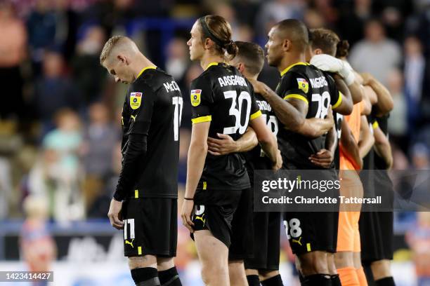 James McClean of Wigan Athletic is seen not taking part in a minute silence, as players and spectators pay tribute to Her Majesty Queen Elizabeth II,...