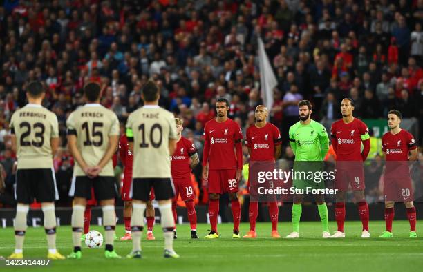 Players of Liverpool observe a minute silence to pay tribute to Her Majesty Queen Elizabeth II, who died away at Balmoral Castle on September 8 prior...