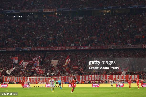 General view as fans of Bayern Munich raise a banner which reads 'Twenty Is Plenty, The Only Reasonable Price Cap' during the UEFA Champions League...