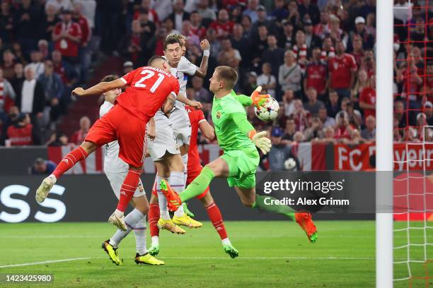 Lucas Hernandez of Bayern Munich scores their side's first goal as Marc-Andre ter Stegen of FC Barcelona attempts to make a save during the UEFA...