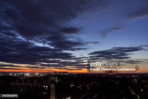 sunset sky with clouds over the city. - overcast city stock pictures, royalty-free photos & images