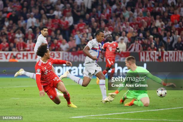 Leroy Sane of Bayern Munich scores their side's second goal as Marc-Andre ter Stegen of FC Barcelona attempts to make a save during the UEFA...