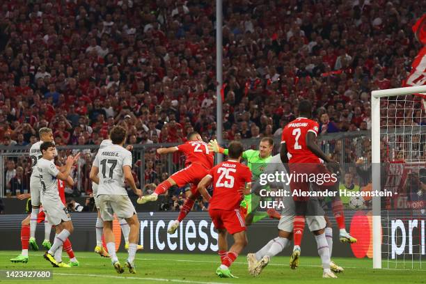 Lucas Hernandez of Bayern Munich scores their side's first goal whilst under pressure from Marc-Andre ter Stegen of FC Barcelona during the UEFA...