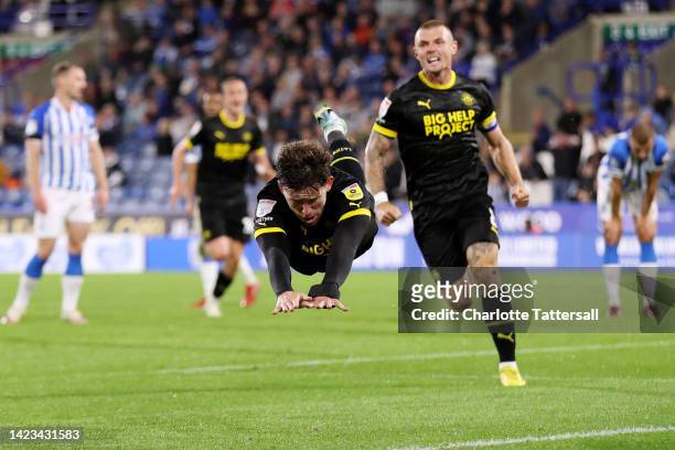 Callum Lang of Wigan Athletic celebrates after scoring their sides second goal during the Sky Bet Championship between Huddersfield Town and Wigan...