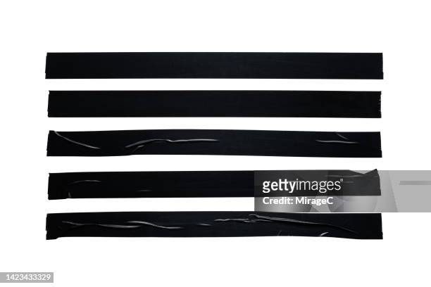 black duct tape long strips isolated on white - cinta adhesiva fotografías e imágenes de stock