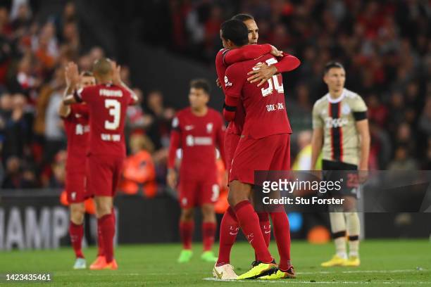 Virgil van Dijk of Liverpool embraces teammate Joel Matip following their sides victory in the UEFA Champions League group A match between Liverpool...