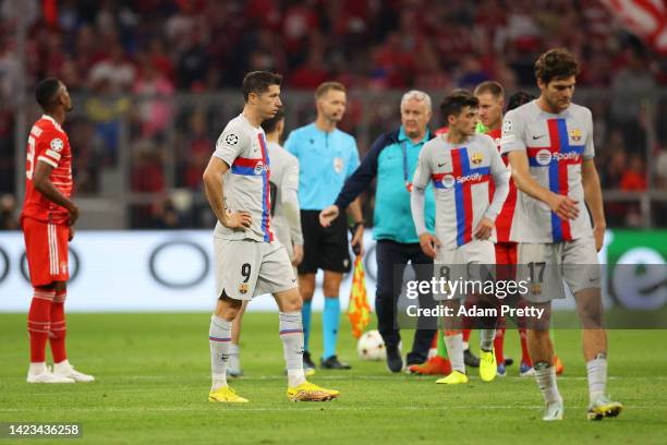 Robert Lewandowski of FC Barcelona looks dejected as players of FC Barcelona leave the field after the final whistle of the UEFA Champions League...