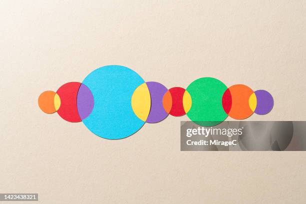 paper craft venn diagram composed of multiple crossing circles - exchanging information stock pictures, royalty-free photos & images