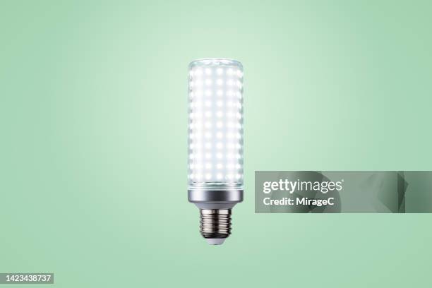 illuminated led light bulb made of led beads glowing in mid air - led lampe photos et images de collection