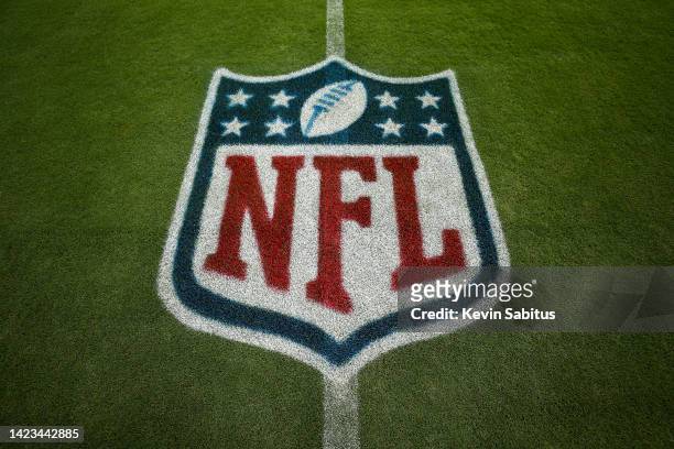 Detail shot of the NFL shield logo painted on the grass prior to an NFL football game between the New York Giants and the Tennessee Titans at Nissan...