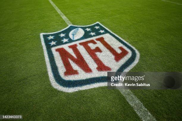 Detail shot of the NFL shield logo painted on the grass prior to an NFL football game between the New York Giants and the Tennessee Titans at Nissan...