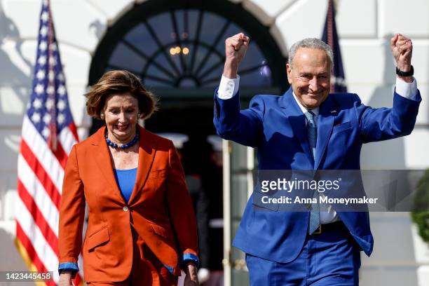 Speaker of the House Nancy Pelosi and Senate Majority Leader Chuck Schumer arrive to an event celebrating the passage of the Inflation Reduction Act...