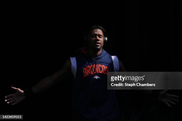 Russell Wilson of the Denver Broncos pauses for a moment to himself before the game against the Seattle Seahawks at Lumen Field on September 12, 2022...