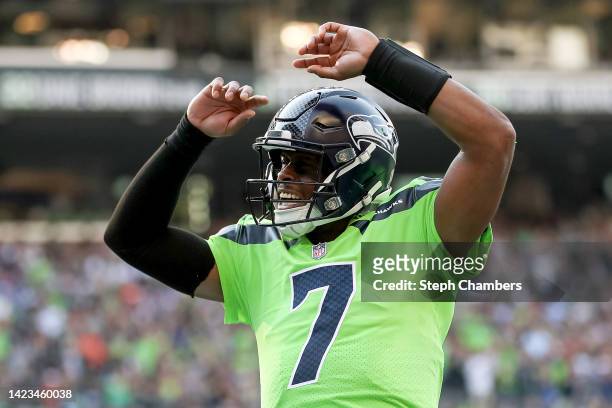 Geno Smith of the Seattle Seahawks celebrates a touchdown during the first quarter against the Denver Broncos at Lumen Field on September 12, 2022 in...
