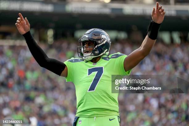 Geno Smith of the Seattle Seahawks celebrates a touchdown during the first quarter against the Denver Broncos at Lumen Field on September 12, 2022 in...