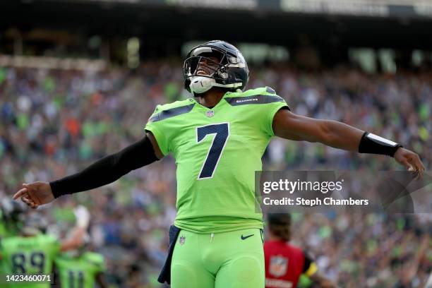 Geno Smith of the Seattle Seahawks celebrates a touchdown during the first quarter against the Denver Broncos at Lumen Field on September 12, 2022 in...