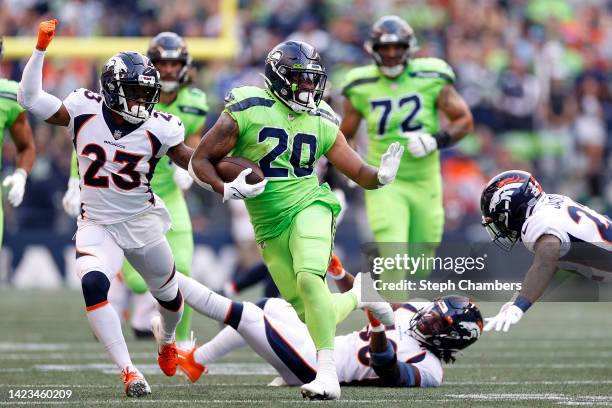 Rashaad Penny of the Seattle Seahawks carries the ball during the second quarter against the Denver Broncos at Lumen Field on September 12, 2022 in...