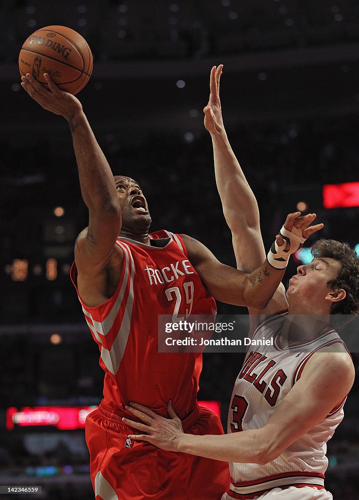 Houston Rockets Marcus Marcus Camby of the Houston Rockets shoots against Omer Asik of the ...