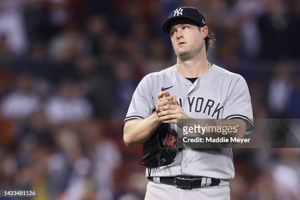 Gerrit Cole of the New York Yankees reacts after Xander Bogaerts of the Boston Red Sox hit a home run during the sixth inning at Fenway Park on...