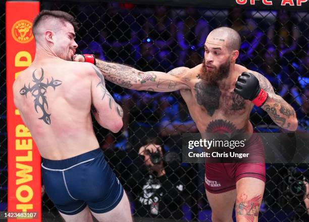 Malik Lewis punches Trevor Peek in a lightweight fight during Dana White's Contender Series season six, week eight at UFC APEX on September 13, 2022...