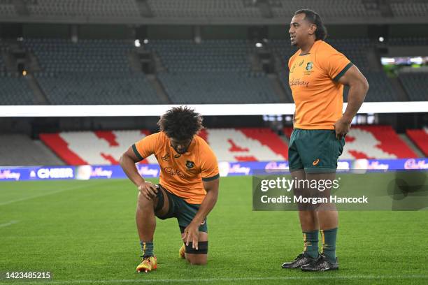 Rob Valetini and Pone Fa'amausili of the Wallabies prepare for a team photo during the Australian Wallabies captain's run at Marvel Stadium on...