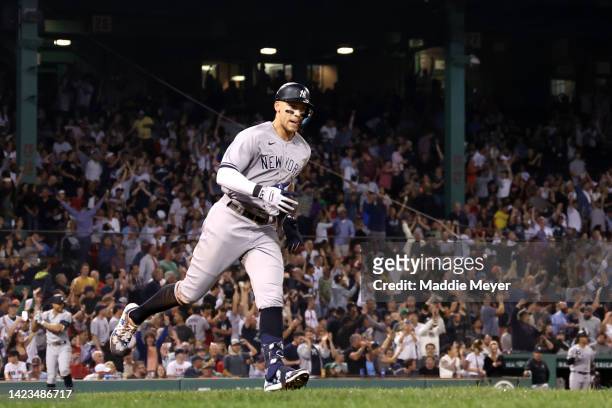 Aaron Judge of the New York Yankees rounds the bases after hitting a home run against the Boston Red Sox during the eighth inning at Fenway Park on...
