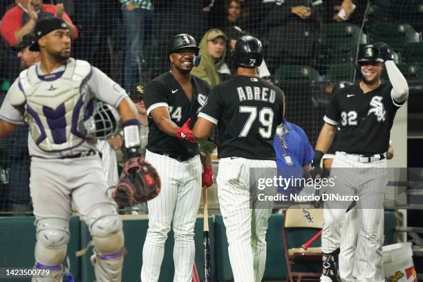 Jose Abreu of the Chicago White Sox is congratulated by Eloy Jimenez of the Chicago White Sox following a home run during the eighth inning of a game...