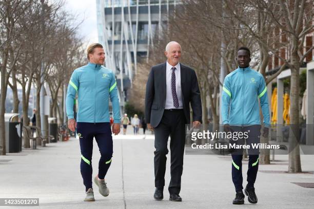 Graham Arnold is joined by players Garang Kuol and Jason Cummings during a Socceroos squad announcement at King St Wharf on September 14, 2022 in...