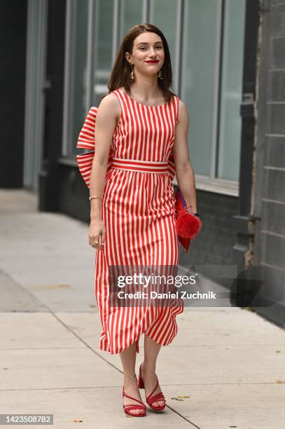 Guest is seen wearing a red and white striped dress, red bag and red heels outside the Jonathan Simkhai show during New York Fashion Week S/S 2023 on...