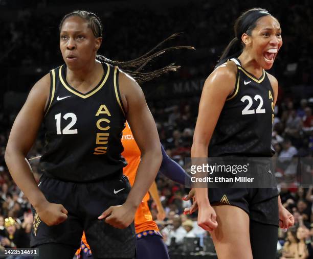 Chelsea Gray and A'ja Wilson of the Las Vegas Aces react after Gray scored and got a foul call against the Connecticut Sun in the third quarter of...