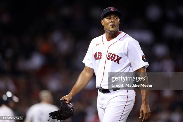 Jeurys Familia of the Boston Red Sox walks to the dugout after pitching during the tenth inning against the New York Yankees at Fenway Park on...