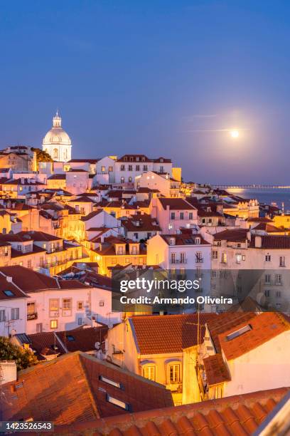 View of the typical Alfama neighborhood in Lisbon, Portugal - dome of the national pantheon.