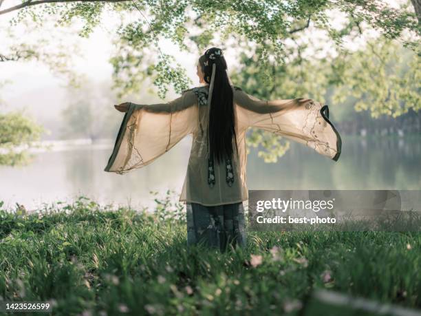 girl wearing ancient chinese clothes - bestphoto stock pictures, royalty-free photos & images