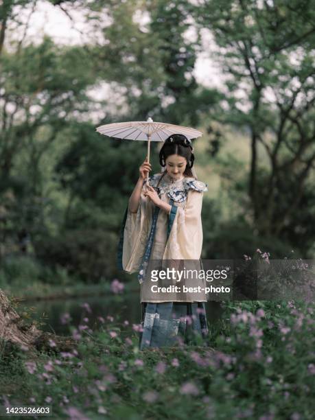 girl wearing ancient chinese clothes - bestphoto stock pictures, royalty-free photos & images