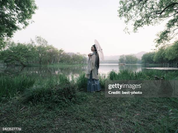 girl wearing ancient chinese clothes - bestphoto stock pictures, royalty-free photos & images