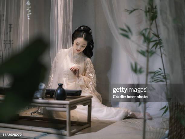 girl wearing ancient chinese clothes - bestphoto stock pictures, royalty-free photos & images