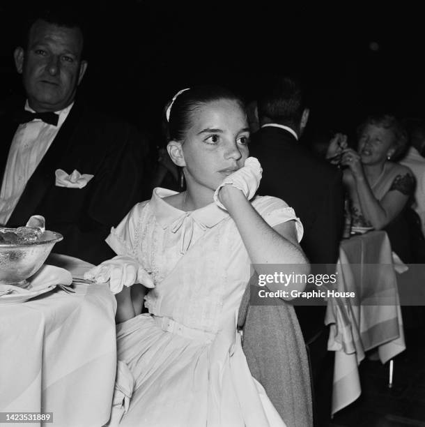 American actress, singer and dancer Liza Minnelli watches her mother's opening night performance at the Cocoanut Grove nightclub, part of the...