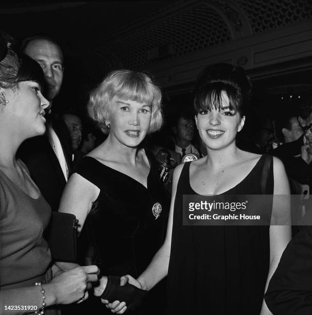 American Hollywood gossip columnist May Mann and American actress, singer and dancer Liza Minnelli among guests attending a party following...