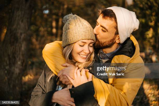 kiss on a head - falling in love stock pictures, royalty-free photos & images