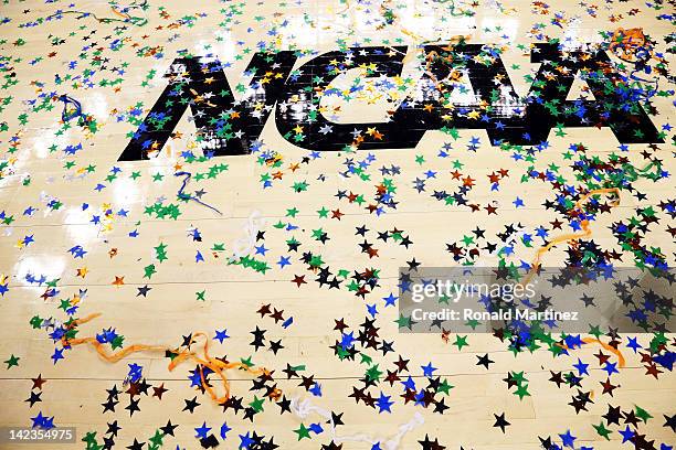 Confetti is seen on the NCAA logo after the Kentucky Wildcats defeat the Kansas Jayhawks 67-59 in the National Championship Game of the 2012 NCAA...