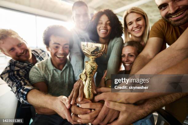 we won a trophy! - holding trophy stock pictures, royalty-free photos & images